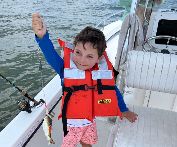 Little boy with Blowfish on a hook